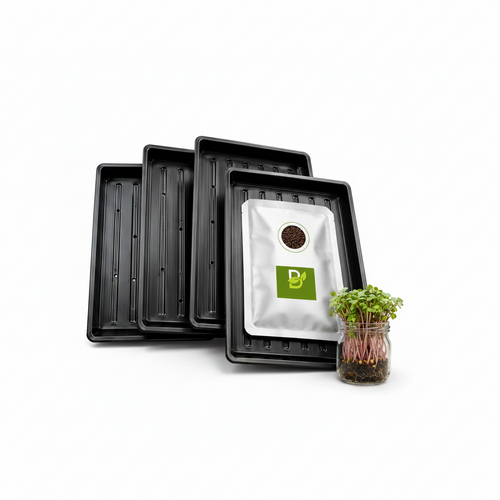 Black growing trays with a seed pouch and microgreens